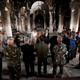 Iraqi priests hold the first mass at the Grand Immaculate Church since it was recaptured from Islamic State in Qaraqosh